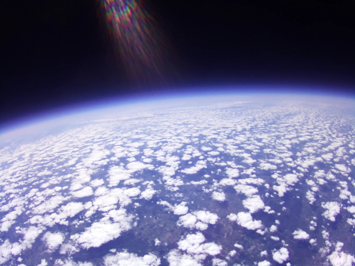 Earth and cloud cover photographed by the NSL-45 onboard camera.